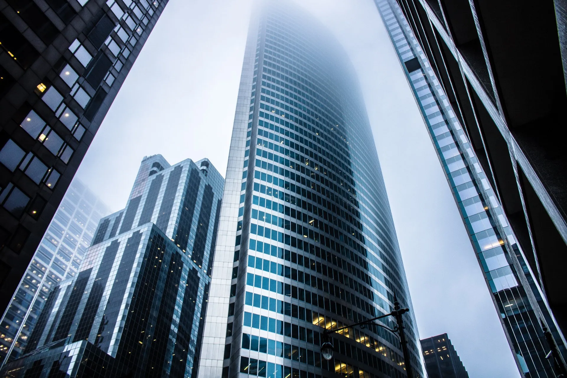 View of a towering skyscraper, symbolizing the hidden dangers of excessive risk in trading.